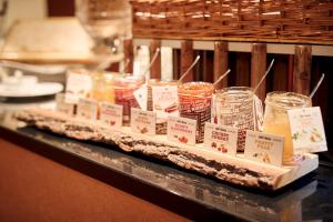 a display of food in jars on a table at Van der Valk Theaterhotel Almelo in Almelo