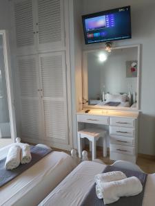 A bed or beds in a room at Baracunda Apartments
