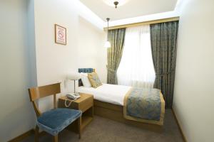 Postel nebo postele na pokoji v ubytování Cumbali Suite Hotel