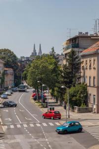 a busy city street with cars on the road at Rooms 88 in Zagreb