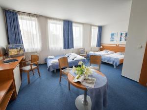Postel nebo postele na pokoji v ubytování EA Hotel Populus