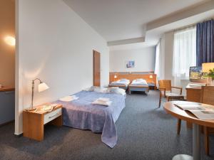 Postel nebo postele na pokoji v ubytování EA Hotel Populus