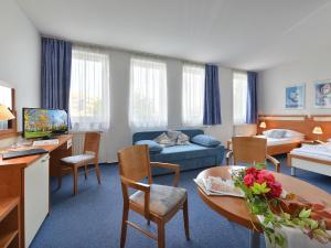 Postel nebo postele na pokoji v ubytování EA Hotel Populus