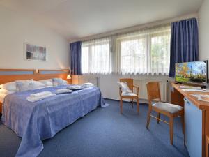 Postel nebo postele na pokoji v ubytování EA Hotel Populus