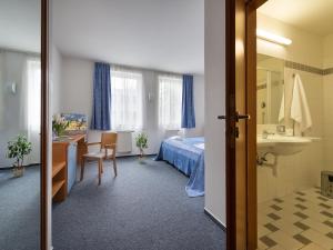 Postel nebo postele na pokoji v ubytování EA Hotel Populus