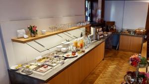 a buffet line with a lot of food on it at Gästehaus Rössle in Weinstadt
