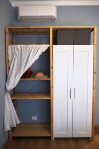 a closet with a bunk bed and a white cabinet at La Casetta del Viaggiatore - "Traveller's Home" in Torre del Lago Puccini
