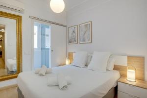 Posteľ alebo postele v izbe v ubytovaní Feelathome Center Apartments
