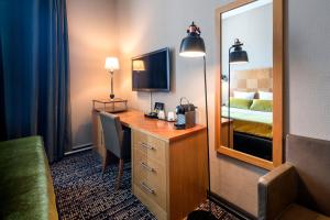 Kuchyň nebo kuchyňský kout v ubytování The Alfred Hotel