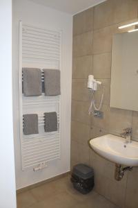 Koupelna v ubytování Garni Hotel Schmaus