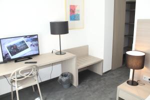 TV a/nebo společenská místnost v ubytování Garni Hotel Schmaus