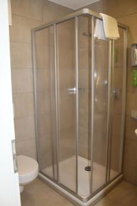 Koupelna v ubytování Garni Hotel Schmaus