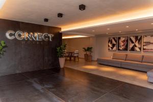 a lobby of a hotel with a sign that reads connect hotel at Nord Easy Connect in João Pessoa