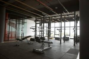 a gym with cardio equipment in a large room at OPAHOME@ Timurbay Seafront Residence 2BR Family suite Seaview and Poolview in Kuantan
