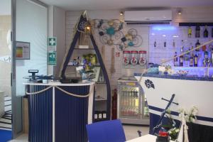 a store with a counter and a refrigerator at Miramare in Pozzallo