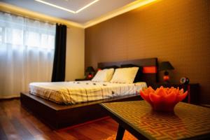 a bedroom with a bed and a table in it at Snooker House in Ponta Delgada +29 photos