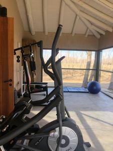 a gym with two exercise bikes in a room at Casa Septem in Villa Seca