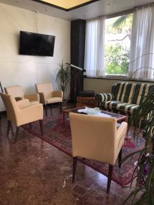 TV a/nebo společenská místnost v ubytování Hotel Palm Beach