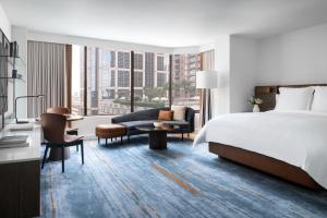 a hotel room with a bed and a large window at Four Seasons Hotel Houston in Houston +37 photos