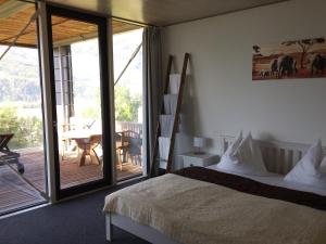 Łóżko lub łóżka w pokoju w obiekcie Glas House - Design Holiday Home