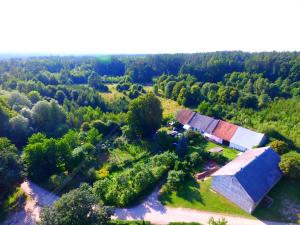 an overhead view of an old barn in a forest at LEŚNA OSADA in Tuchlin
