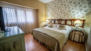 Postel nebo postele na pokoji v ubytování Gran Hotel Mar del Plata