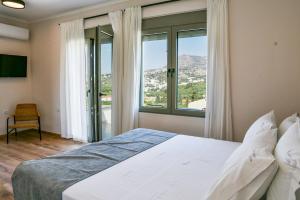 Posteľ alebo postele v izbe v ubytovaní Horizon Villa Almyrida + 37 fotografií