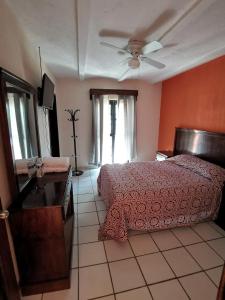 Postel nebo postele na pokoji v ubytování Hotel Boutique Real Tequila