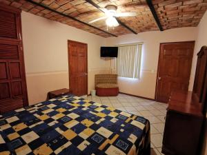 Postel nebo postele na pokoji v ubytování Hotel Boutique Real Tequila
