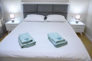 Krevet ili kreveti u jedinici u okviru objekta Click Apartments - Tirana