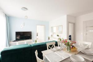 Televízia a/alebo spoločenská miestnosť v ubytovaní Apartament Balticus Deluxe