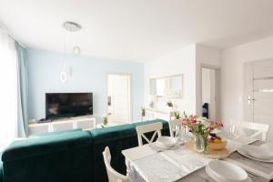 Televízia a/alebo spoločenská miestnosť v ubytovaní Apartament Balticus Deluxe
