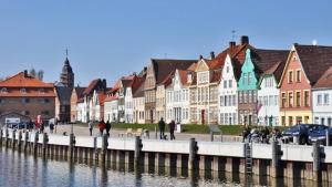 a group of buildings next to a body of water at Stilbruch Glückstadt in Glückstadt +13 photos