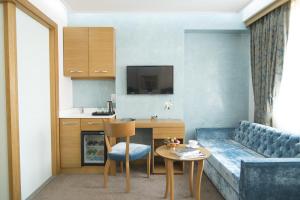Kuchyň nebo kuchyňský kout v ubytování Cumbali Suite Hotel