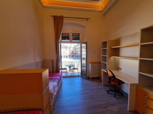 Postel nebo postele na pokoji v ubytování Apartaments Vicus 3 con vistas a la Plaza Mayor de Vic