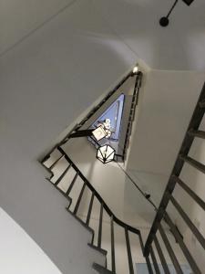 a stairwell with a sticker of a person on the window at Airone Hotel in Naples