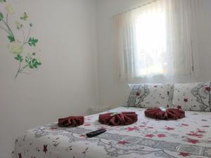 Cama ou camas em um quarto em Pousada Atobá Juquehy Apartamentos