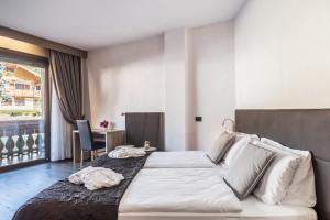 Posteľ alebo postele v izbe v ubytovaní Residence Anda