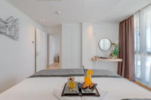 Ένα ή περισσότερα κρεβάτια σε δωμάτιο στο Hotel Pax