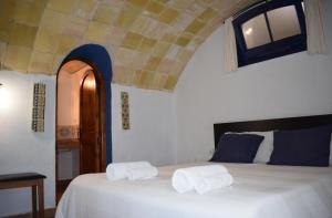 Tempat tidur dalam kamar di L'Àncora de Barà