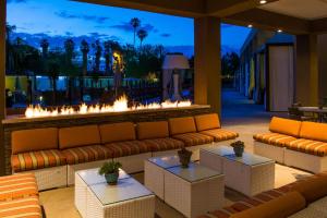 a living room with couches and a fire place at Hyatt Palm Springs in Palm Springs