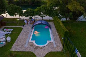 a small swimming pool in a backyard with a tent at Casa Dellˇ Amore in Bihać