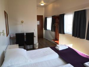 Voodi või voodid majutusasutuse The Vík Inn by Ourhotels toas
