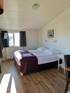 Voodi või voodid majutusasutuse The Vík Inn by Ourhotels toas
