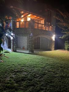 a house at night with a lawn in front of it at Arachova Vip smart chalet-Villa Eva 1 in Arachova