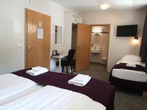 Voodi või voodid majutusasutuse The Vík Inn by Ourhotels toas