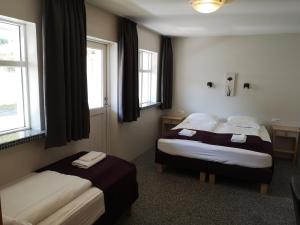 Voodi või voodid majutusasutuse The Vík Inn by Ourhotels toas