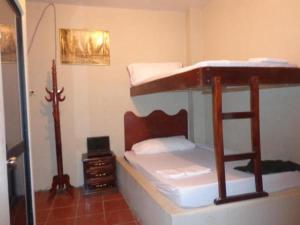 מיטה או מיטות בחדר ב-Auto Hostal Jaramisol