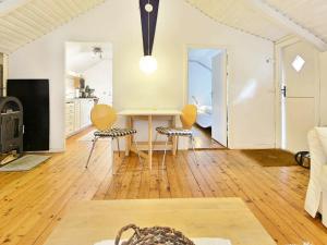 a living room with a table and two chairs at 4 person holiday home in HALLABRO-By Traum in Svarvaremåla