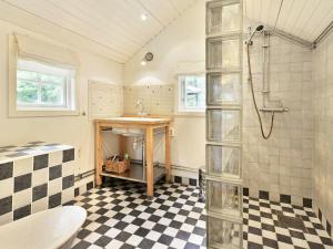 a bathroom with a sink and a shower at 4 person holiday home in HALLABRO-By Traum in Svarvaremåla